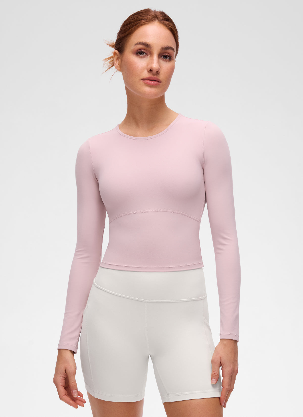 Butterluxe CRZ YOGA Áo thun yoga nữ ôm sát, kiểu crop top, tay dài, đường may phía trước, màu hồng nhạt