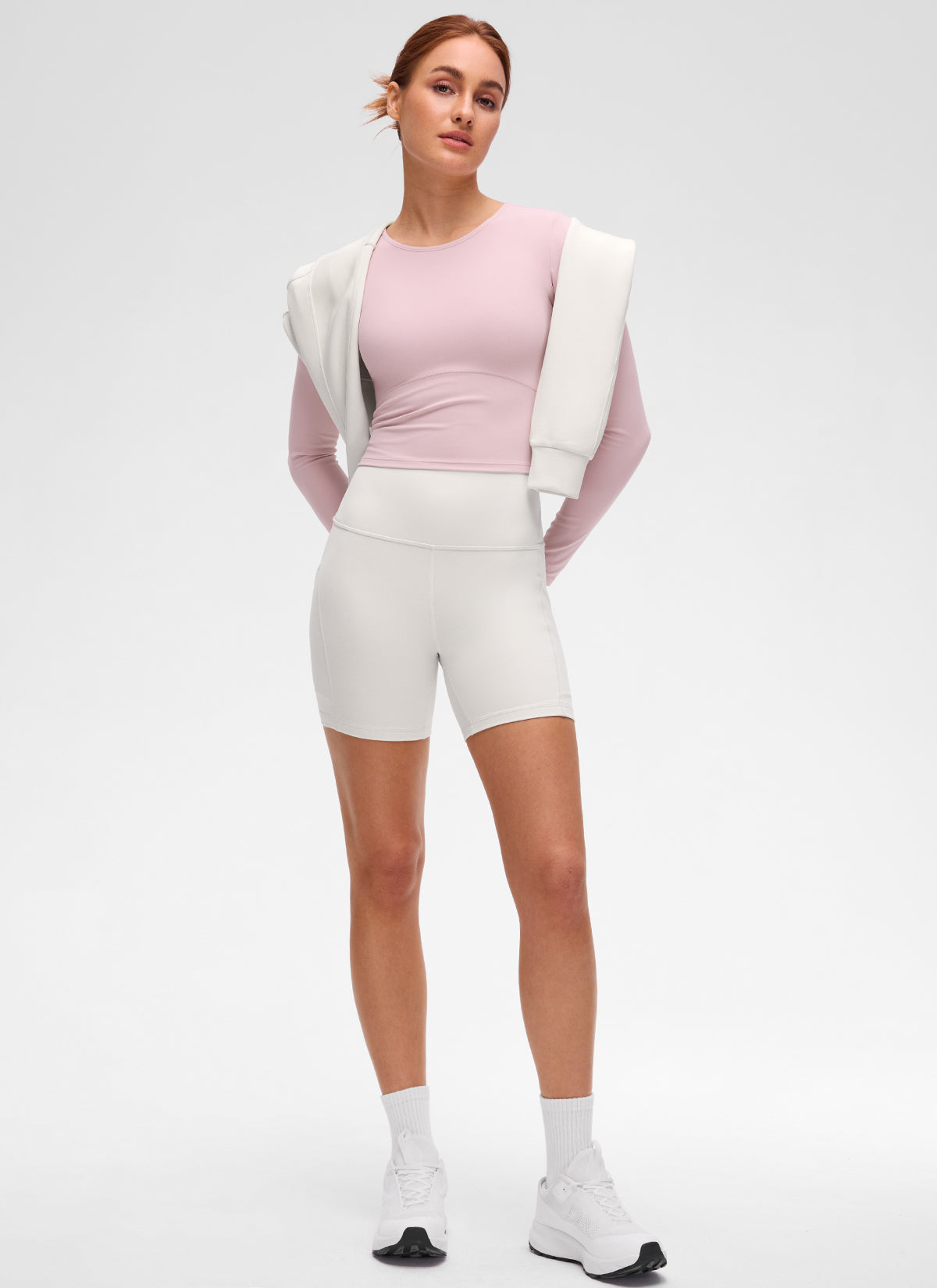 Butterluxe CRZ YOGA Áo thun yoga nữ ôm sát, kiểu crop top, tay dài, đường may phía trước, màu hồng nhạt